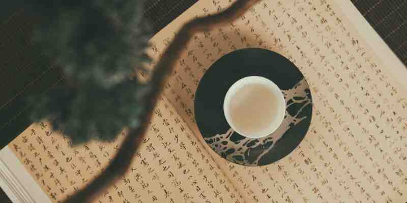 Tea on top of a book of Chinese characters