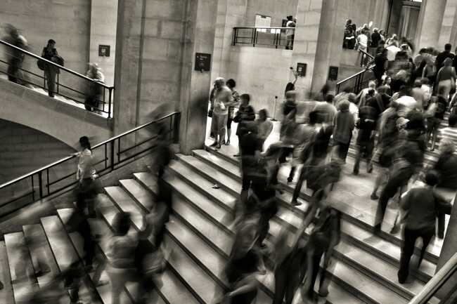 A photo showing a busy hall full of people