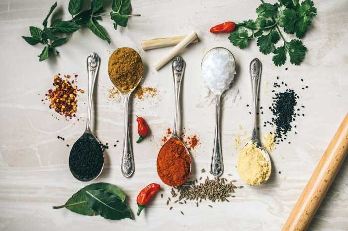 Assortment of colorful Chinese spices and seasonings in different spoons