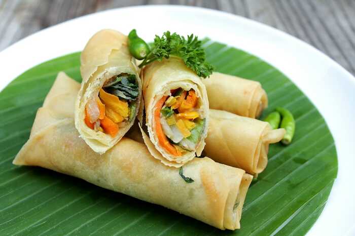 Close-up of beautifully presented spring rolls