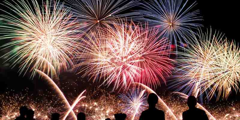 A crowd of people watching fireworks