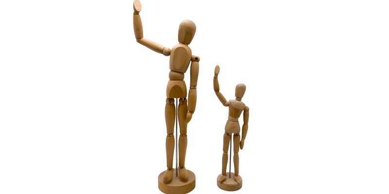 Two wooden dolls waving