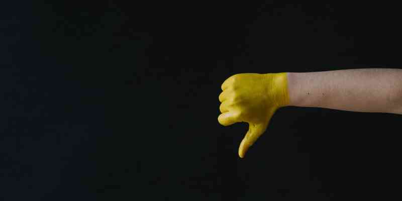 Yellow hand thumbs down