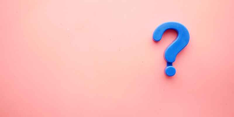 Blue question mark on pink background