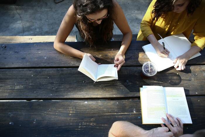 a group reading and writing together