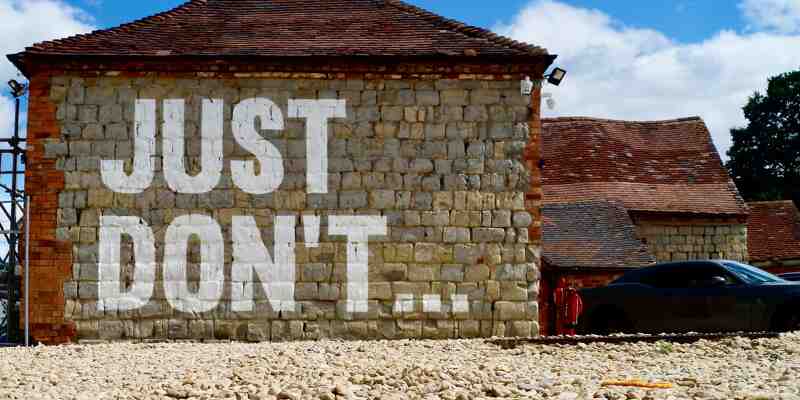 Wall painting saying 'just don't