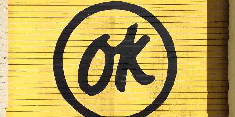 The word OK on a yellow door